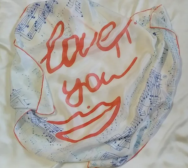 Image of Scarf "Love story. Music by Frаncis Lay" by Tetiana Kononenko (Tanta), size: 89х89 см, made of silk 100%, acrylic for silk, resist, textile marker, batik medium, part of the "Batik" series Photo 5 of 5.